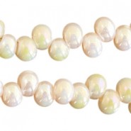 Glass beads 6mm A-symmetrical  Light gold topaz-half diamond coating