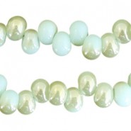 Glaskralen 6mm A-symetrisch Light turquoise blue-half light green pearl shine coating